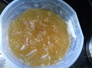 Scrape off fat and discard
